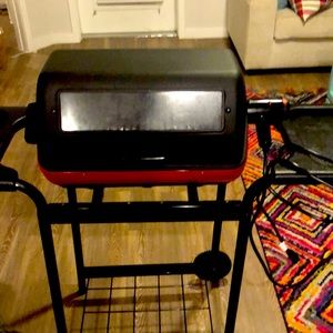 Electric grill with stand and side tables. Only used two times work very well
